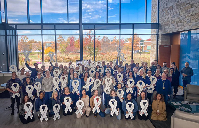 White ribbons around CHEST HQ raise awareness for lung cancer screening and early detection