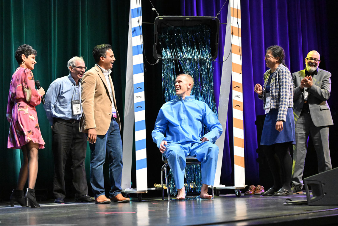 University of Colorado PCCM Fellowship Program Director Tristan J. Huie, MD, FCCP, at center, is surprised by a bucket of streamers after a minigame that built up dramatic tension for something much messier.